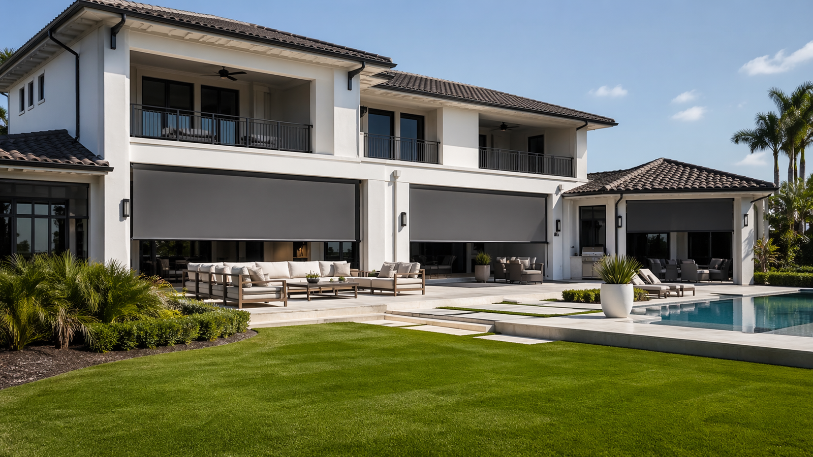 Luxury South Florida mansion exterior custom outdoor roller shades pool Felicia Interiors Miami-Dade